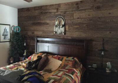 reclaimed mushroom boards used for paneling in a home for a custom bedroom wall