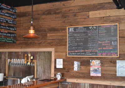 reclaimed mushroom boards used for wall paneling in a Brewery to display signs
