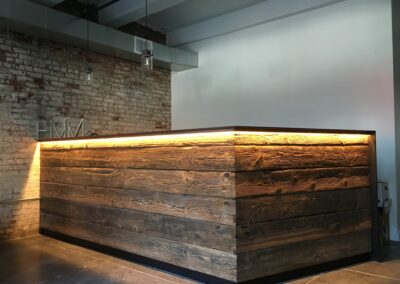 reclaimed mushroom boards used for creating a bar with lights