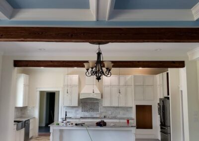 reclaimed mushroom boards used for custom ceiling beams in a kitchen