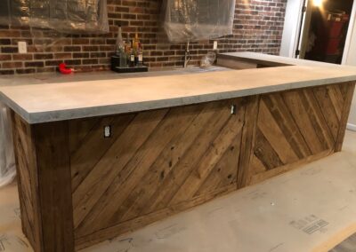 reclaimed mushroom boards used for a custom bar in a home